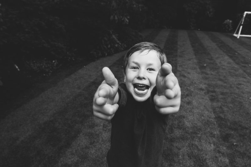 BLACK AND WHITE CHEEKY BOY GARDEN PORTRAIT HADLEY WOOD LONDON FAMILY PHOTOGRAPHER