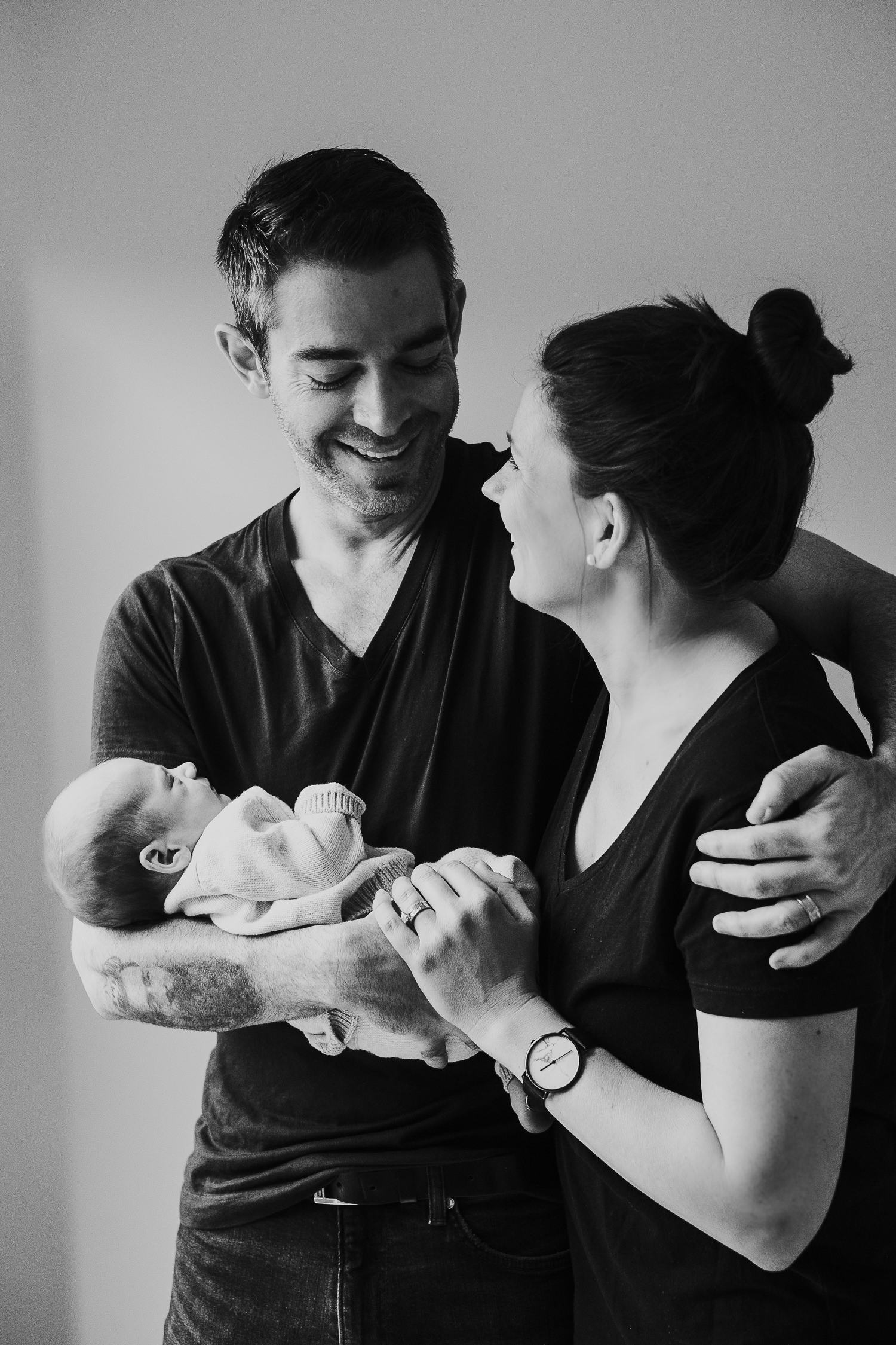 new parents holding baby son black and white photo london newborn photography