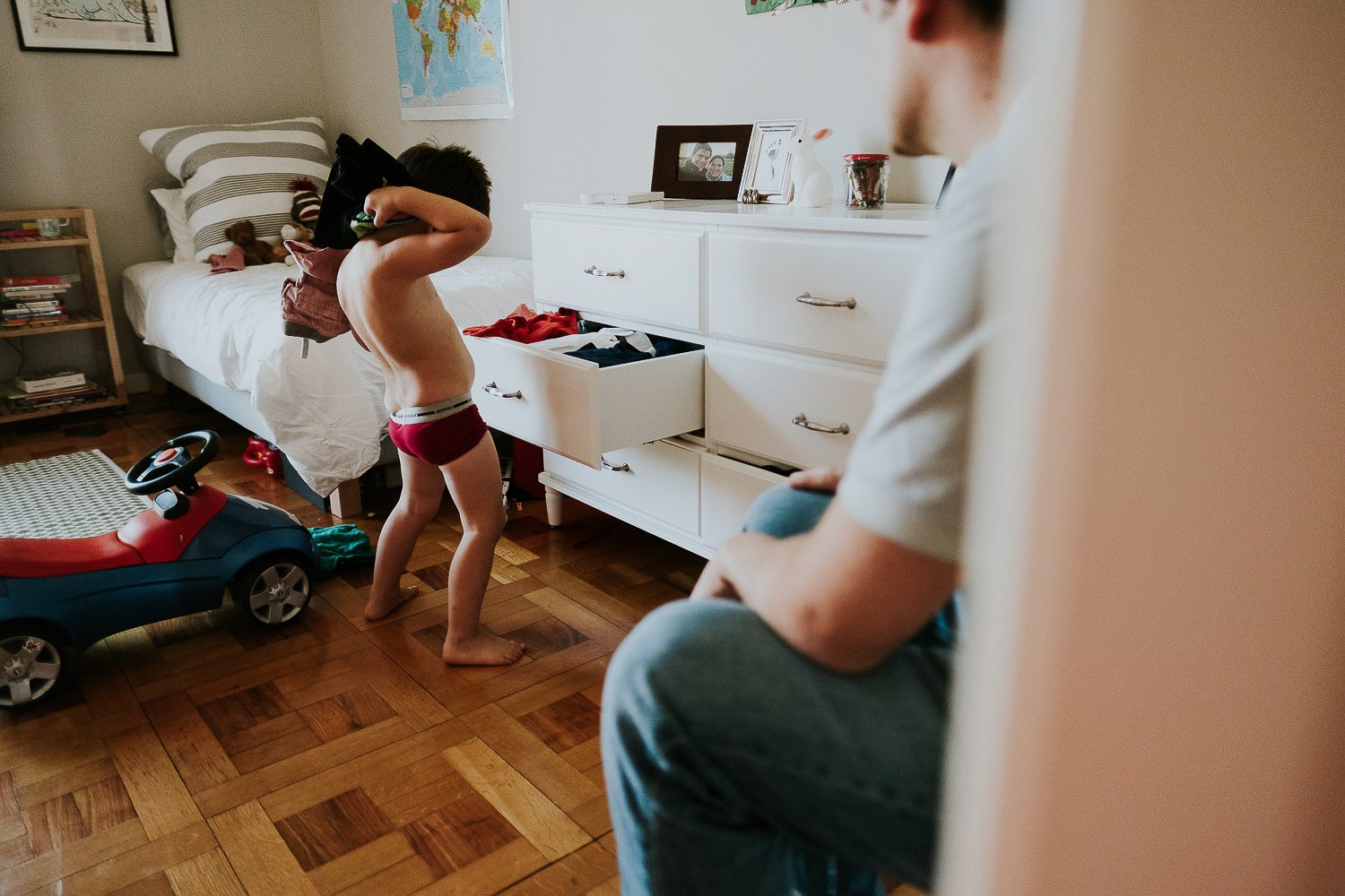 5 reasons you shouldn't wear matching outfits for your family photos. Small boy emptying drawers.
