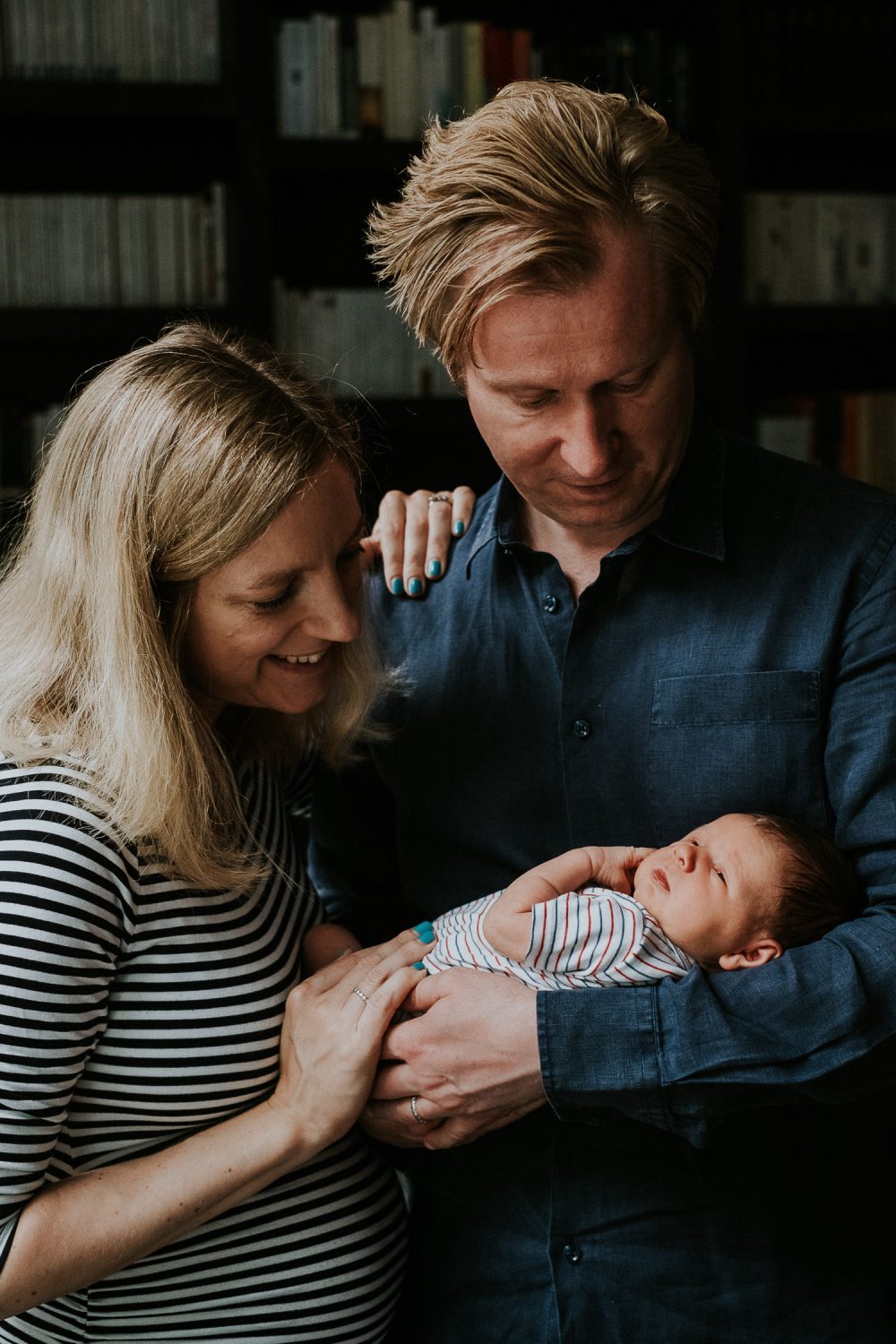 South Kensington Newborn Photographer. Parents with newborn baby girl in arms.