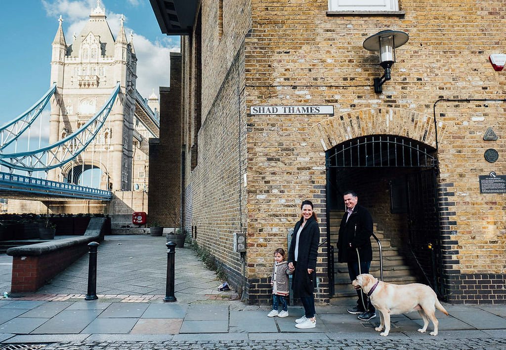 london tower bridge family photo parents toddler and dog