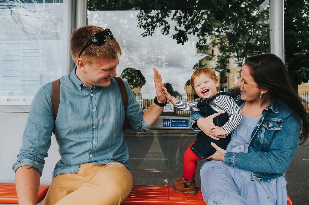 london family at bus stop