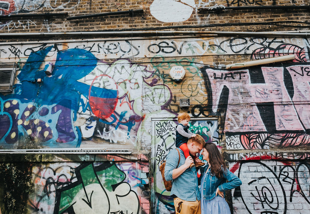 london family shoot grafitti wall parents and toddler