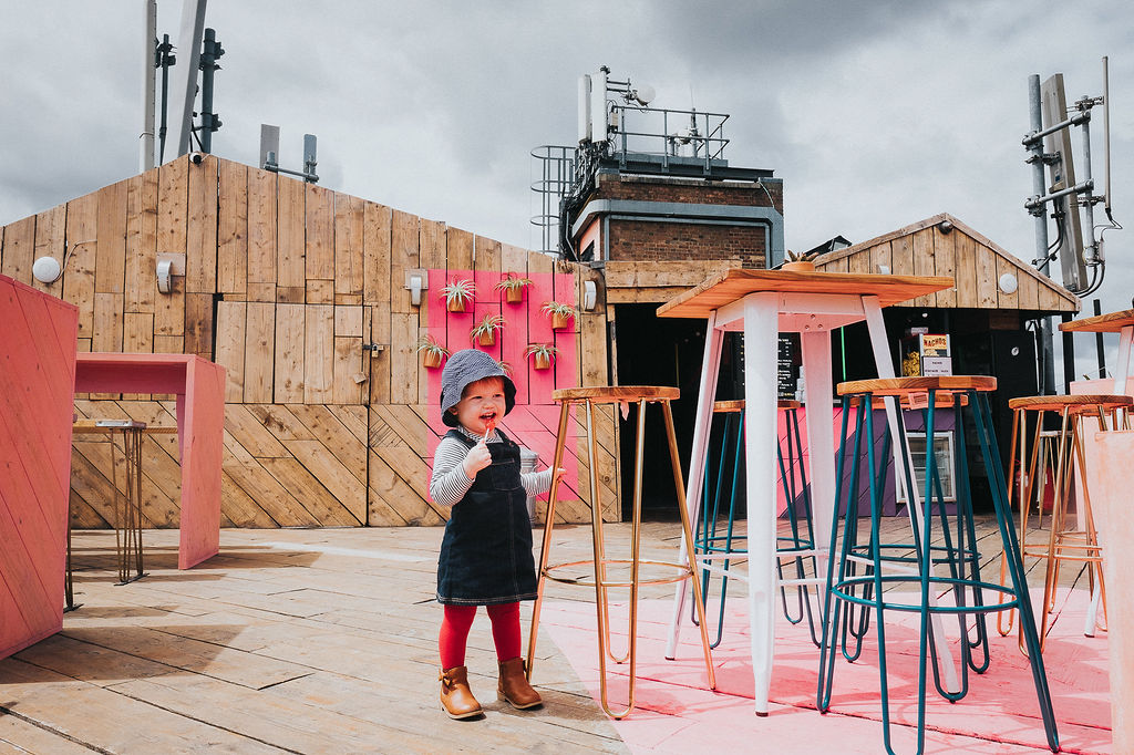 toddler in outside cafe london family photos