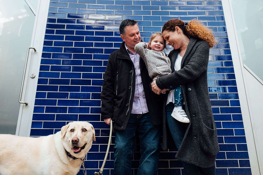 family with toddler on dog walk in London