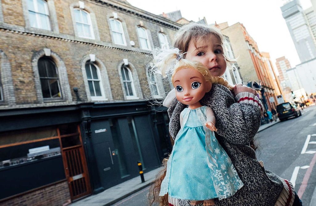 toddler with doll in London