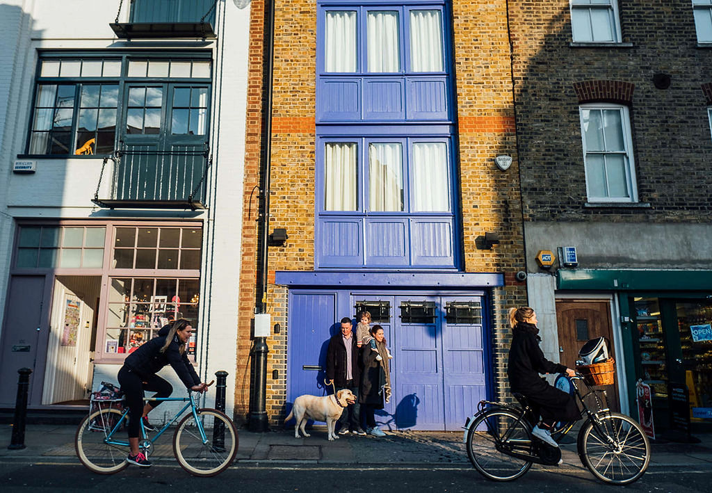 london family photographs family on street with dog and bikes