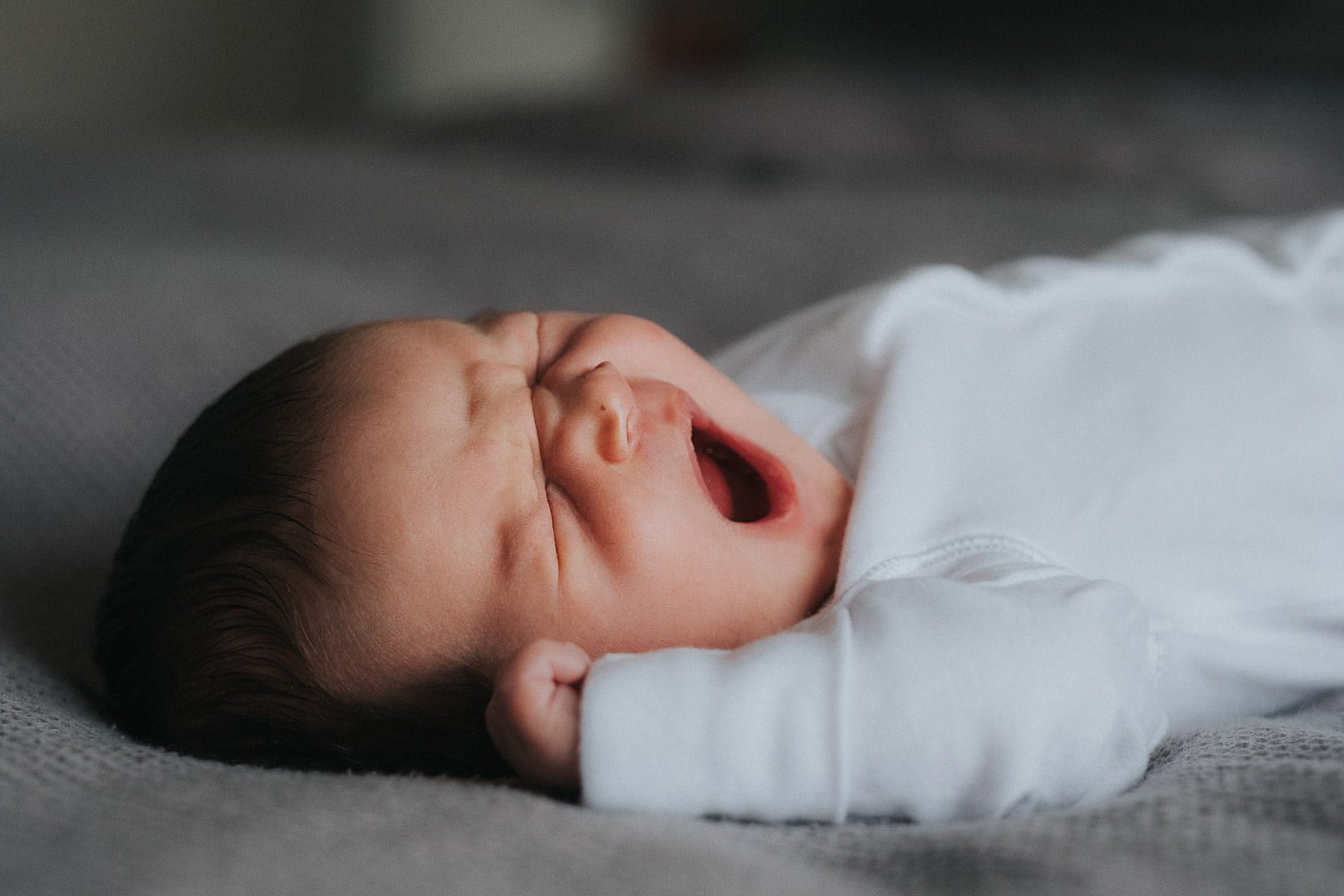 newborn baby yawning photo shoot at home