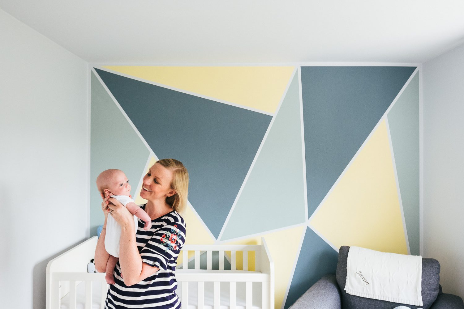 newborn shoot at home mum with baby in nursery