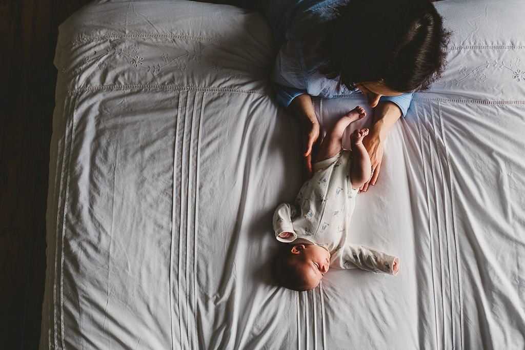newborn baby at home with new parent