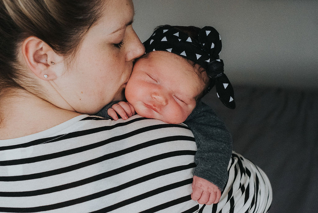 survival tips from new parents - mum and newborn baby sleeping