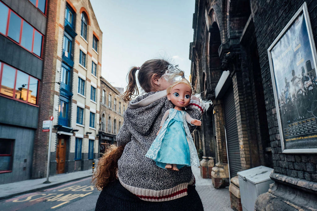 Toddler girl with Elsa doll in London