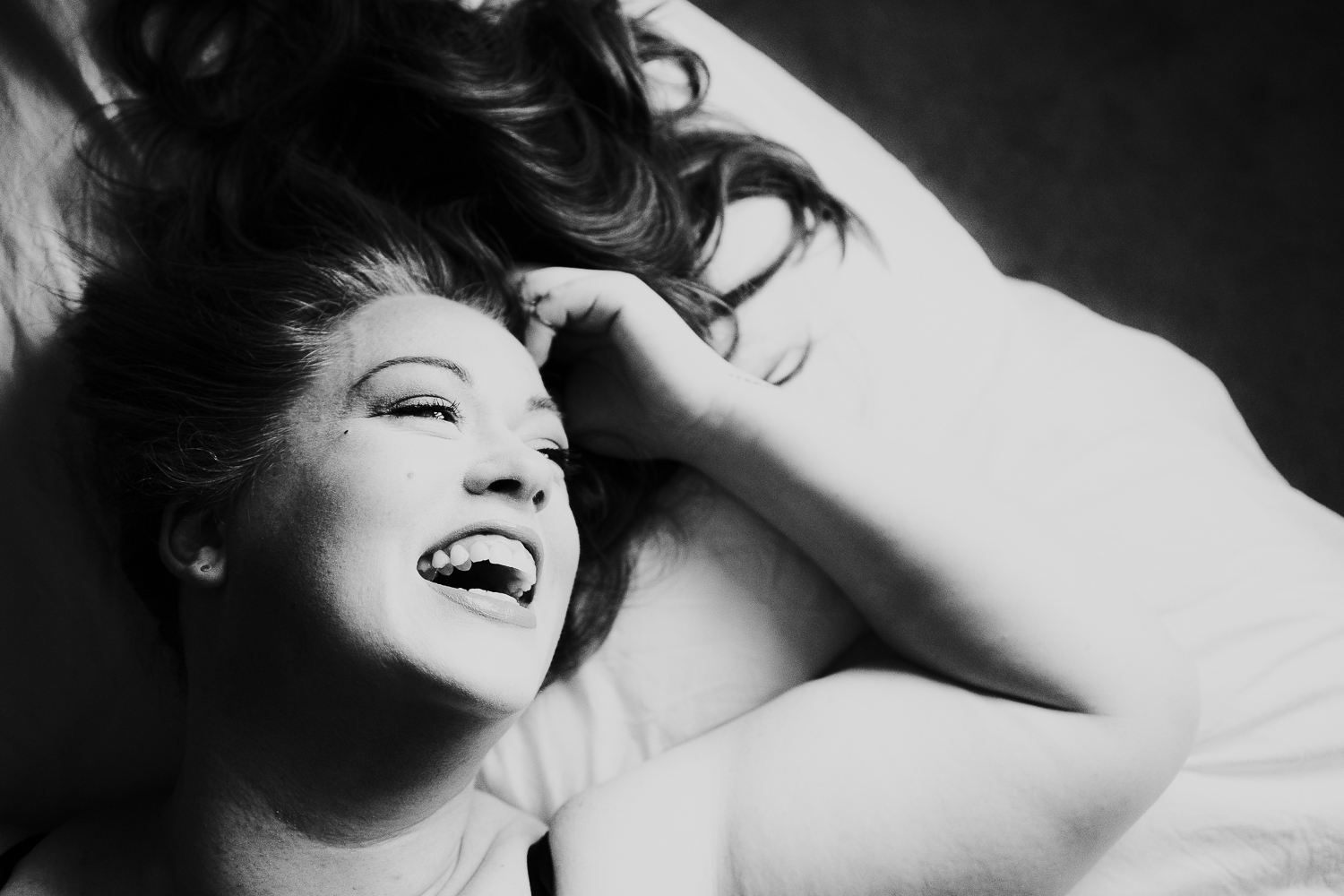kent boudoir photographer black and white close up laughing woman