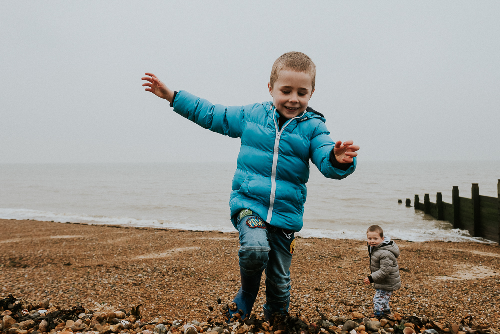 Kent Christmas Mini Photo Shoots Whitstable Beach boy playing