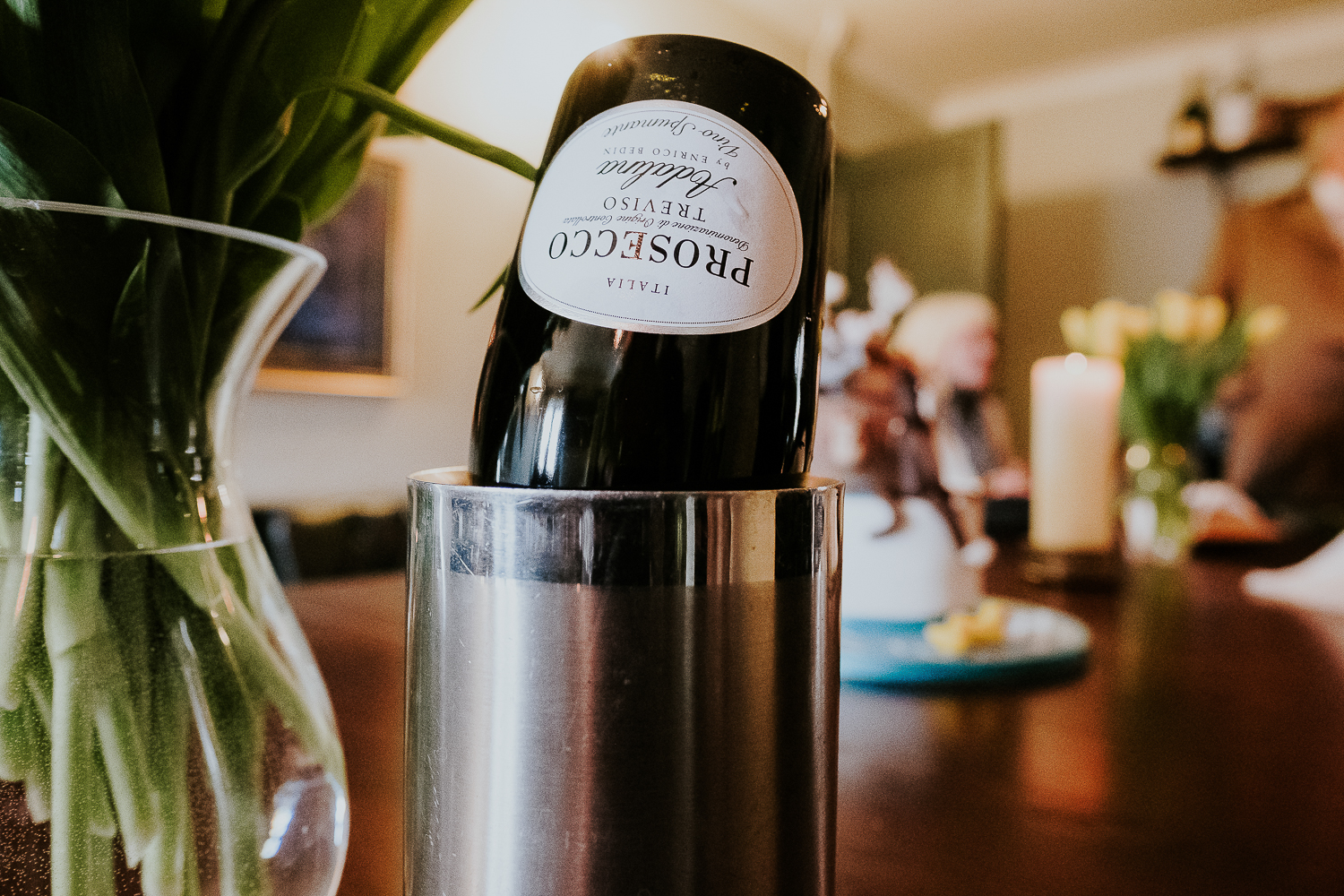 empty upside down bottle of prosecco at london christening photography