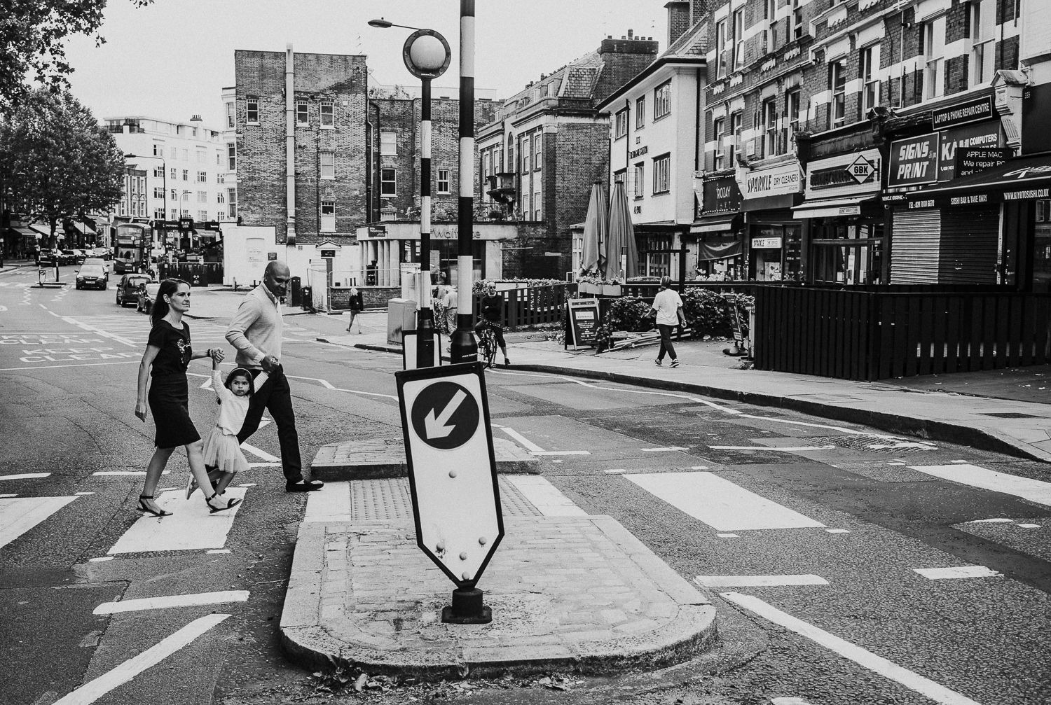 London family photography 2020 black and white photo of parents and young girl pedestrian crossing