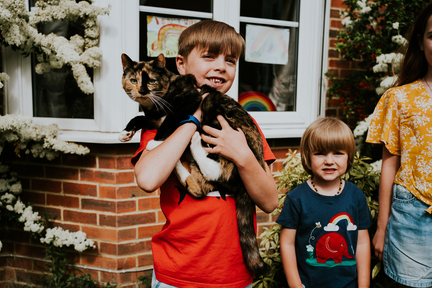 London family photography 2020 doorstep shoot portrait in kent boy with cat
