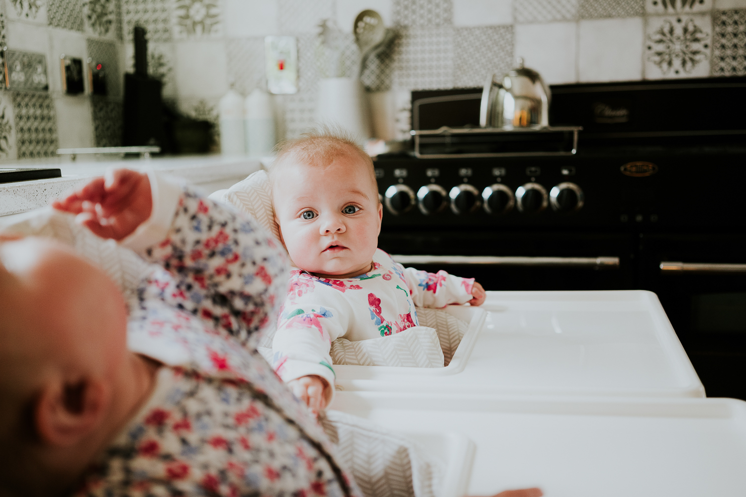 day in the life photo shoot twin baby girls in highchairs