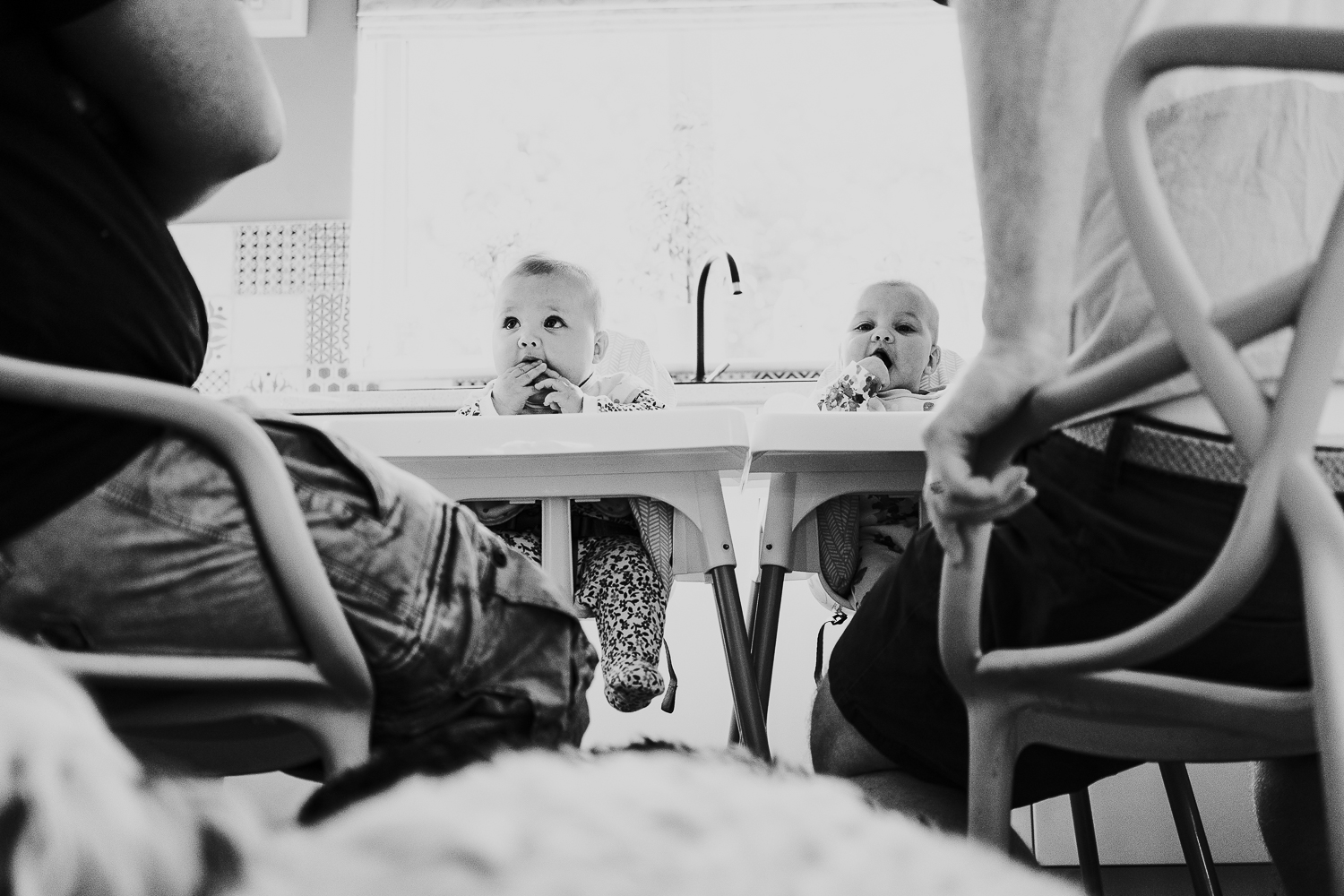day in the life photo shoot two dads with baby twin girls in kitchen family scene