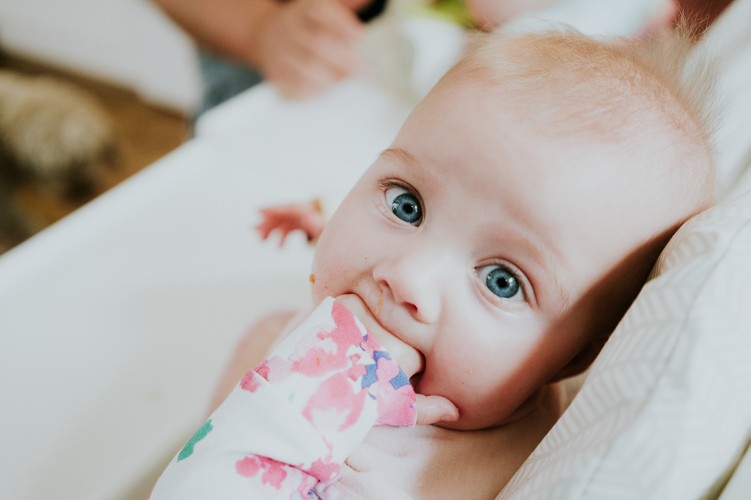day in the life photo shoot baby girl with hand in mouth close up