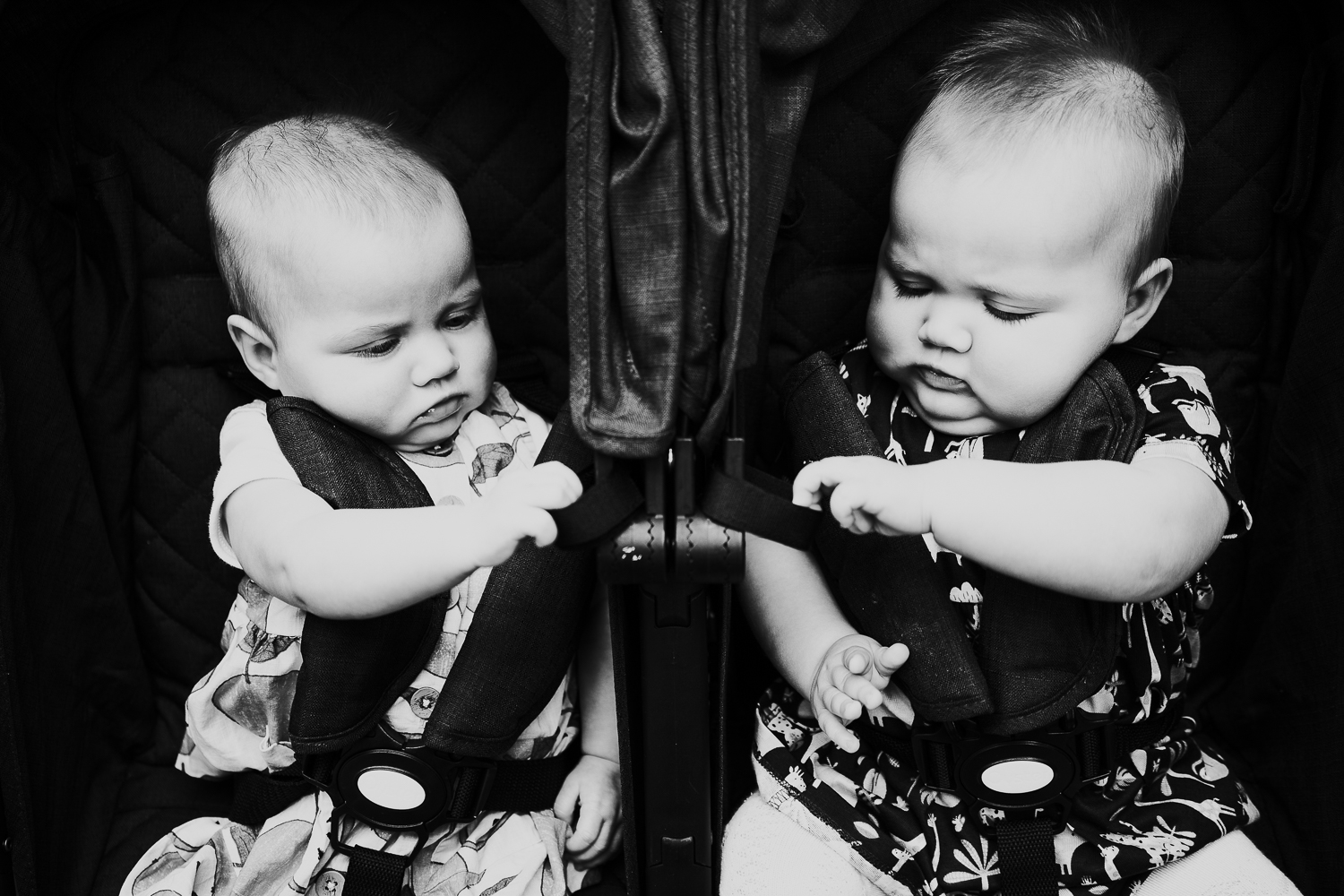 day in the life photo shoot twin baby girls in double pushchair black and white photo