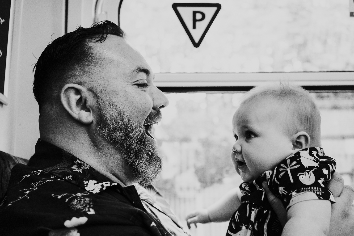 day in the life photo shoot father and baby girl on train black and white shot