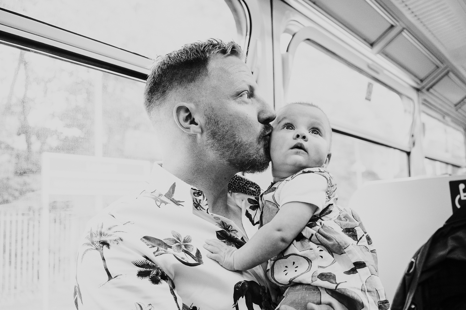 day in the life photo shoot father and baby girl on train black and white shot