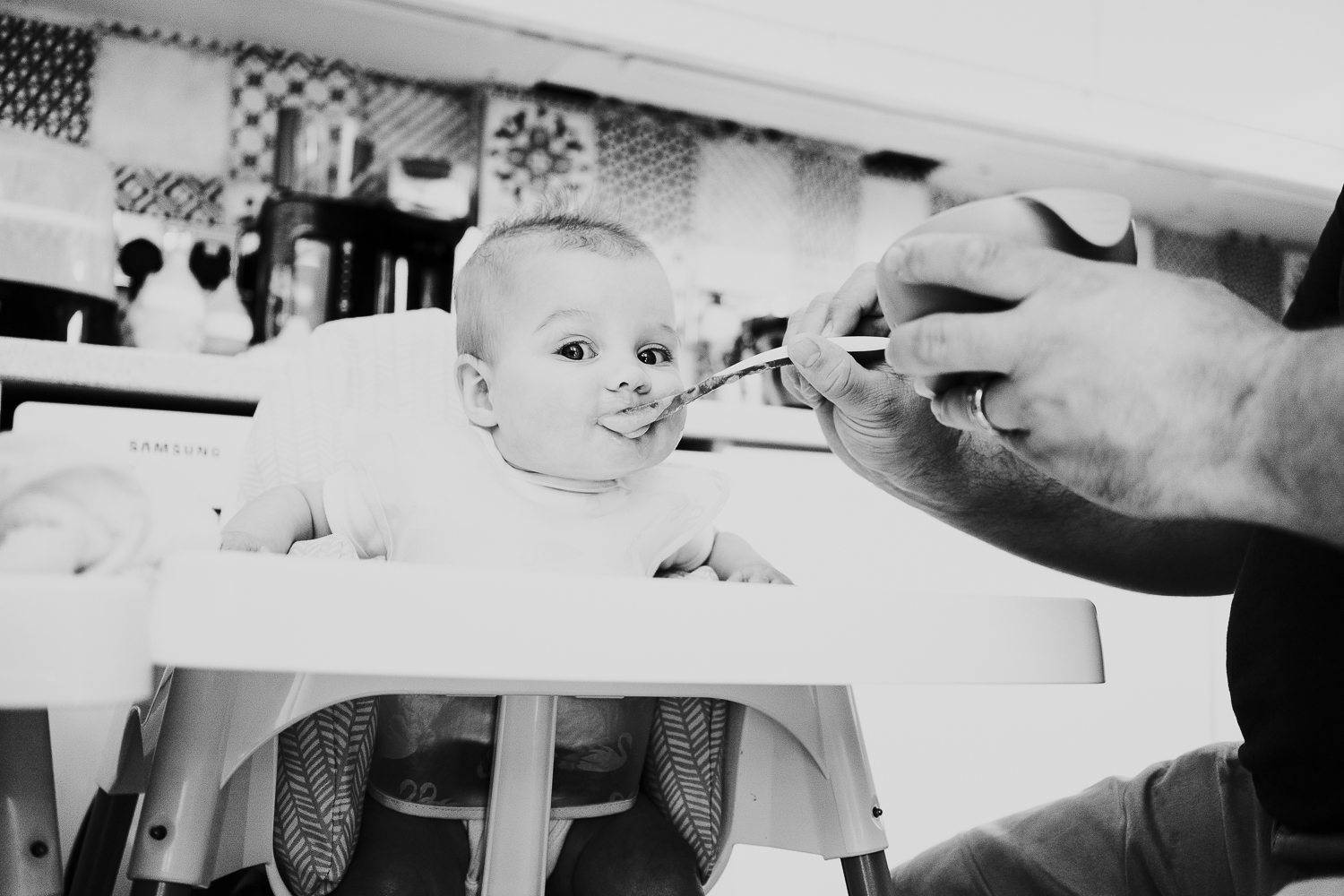 day in the life photo shoot baby girl in highchair black and white photo