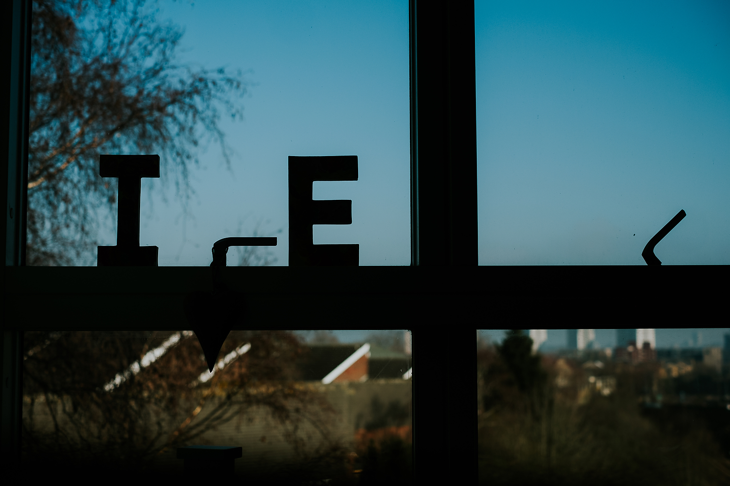 capital I and E for children's names on window at home islington family photographer