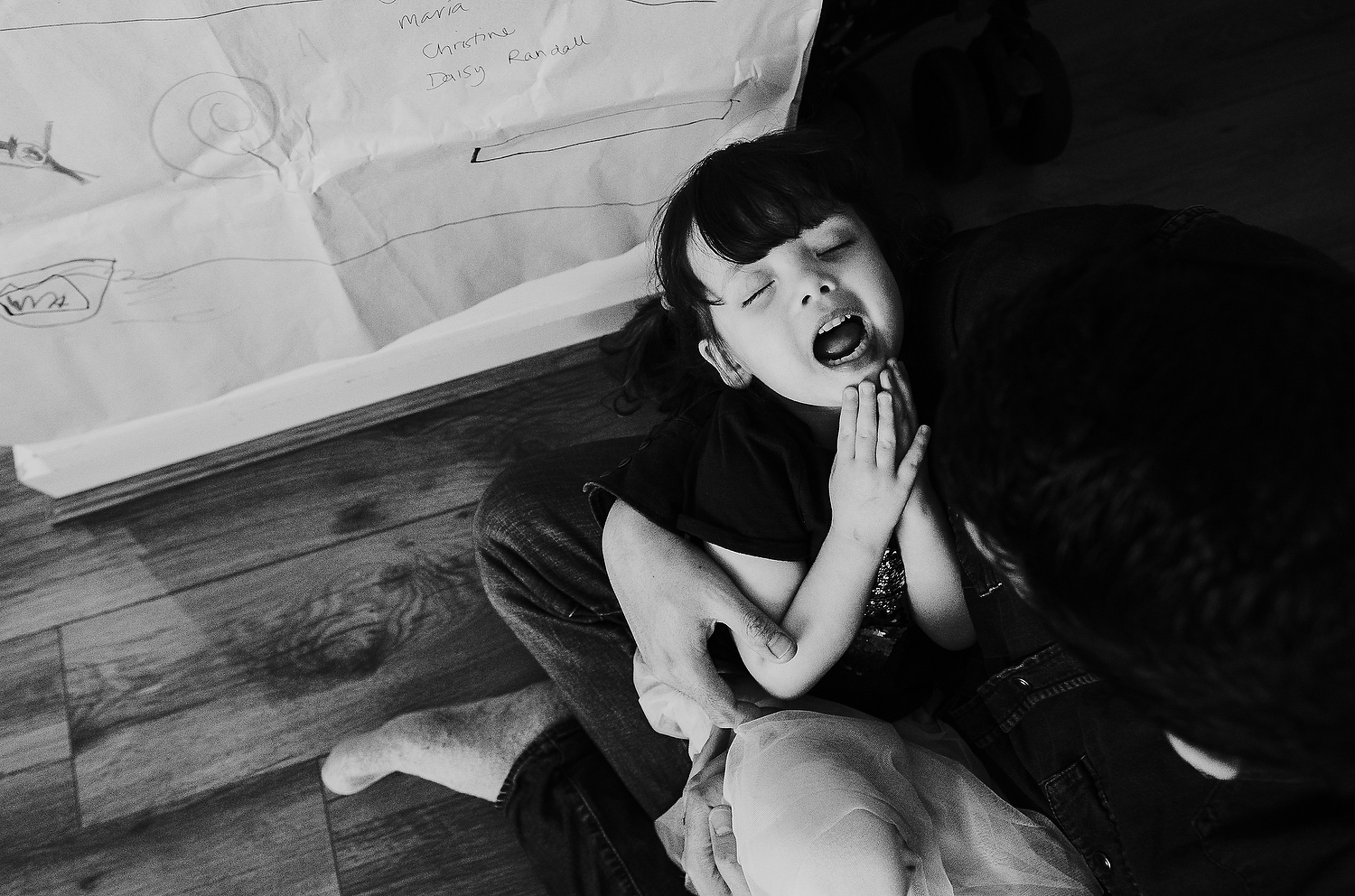 islington family photographer aerial shot of dad holding daughter with funny expression