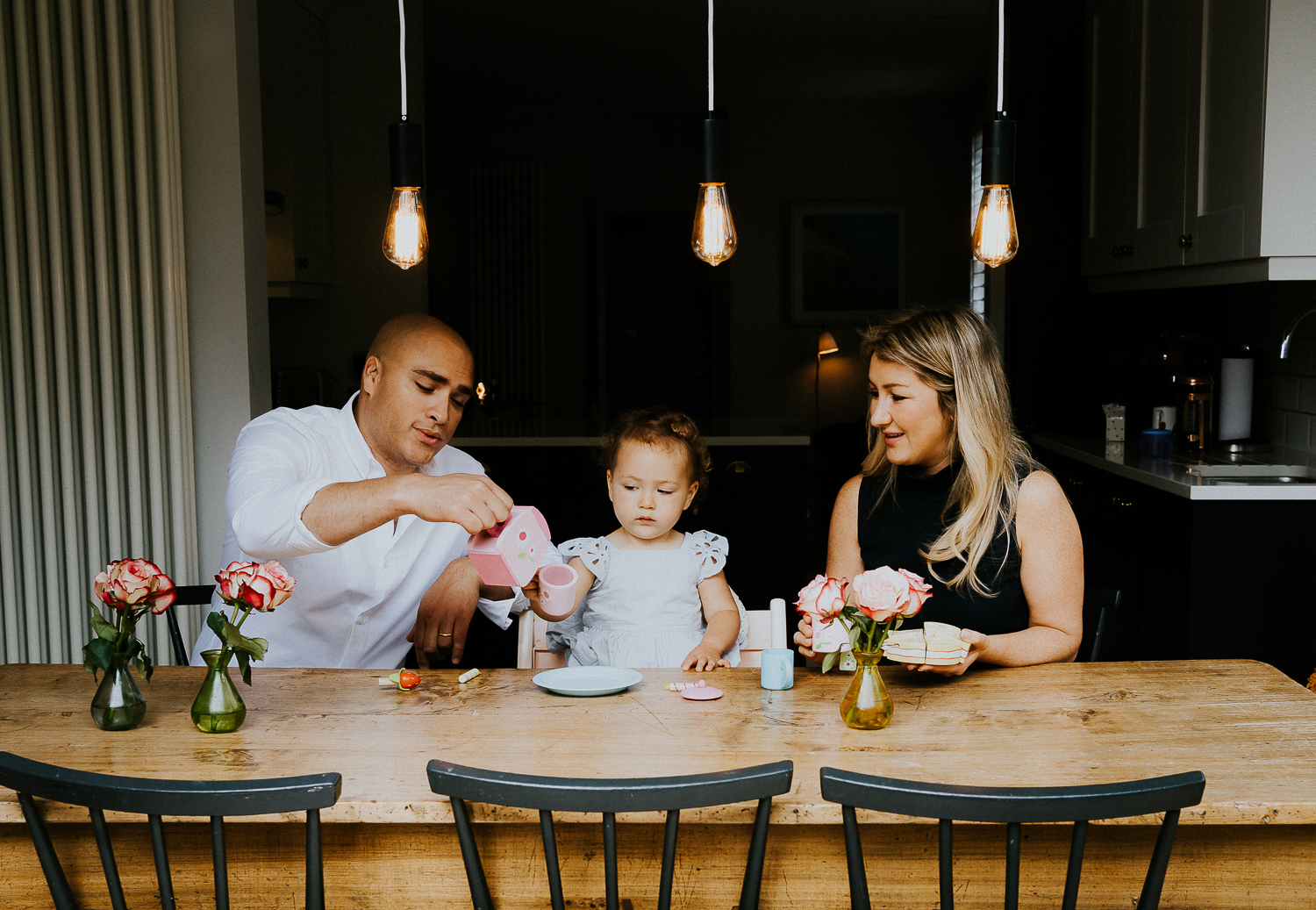 NORTH KENSINGTON FAMILY PHOTO SESSION parents and toddler daughter playing tea time in modern family home