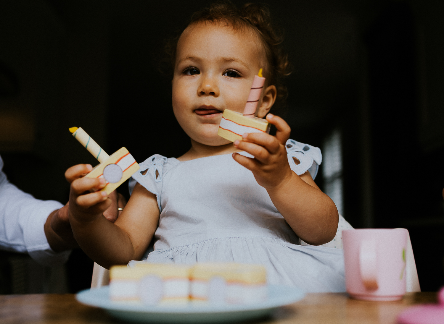NORTH KENSINGTON FAMILY PHOTO SESSION parents and toddler daughter playing tea time in modern family home