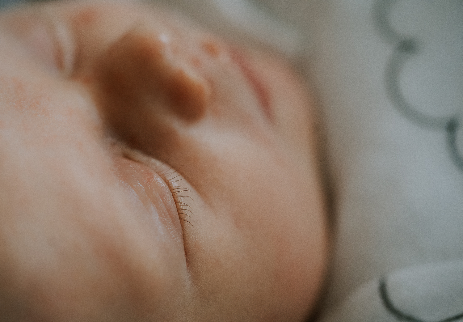 newborn photo session at home in highgate photo of baby boy close up eyelashes