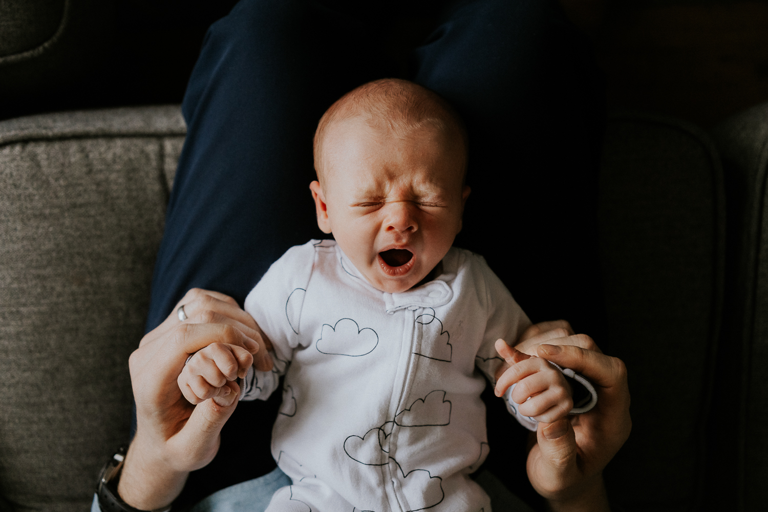 newborn photo session at home in highgate photo of baby boy yawning