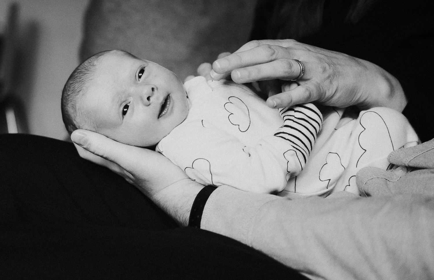 newborn photo session at home in highgate black and white photo of baby boy