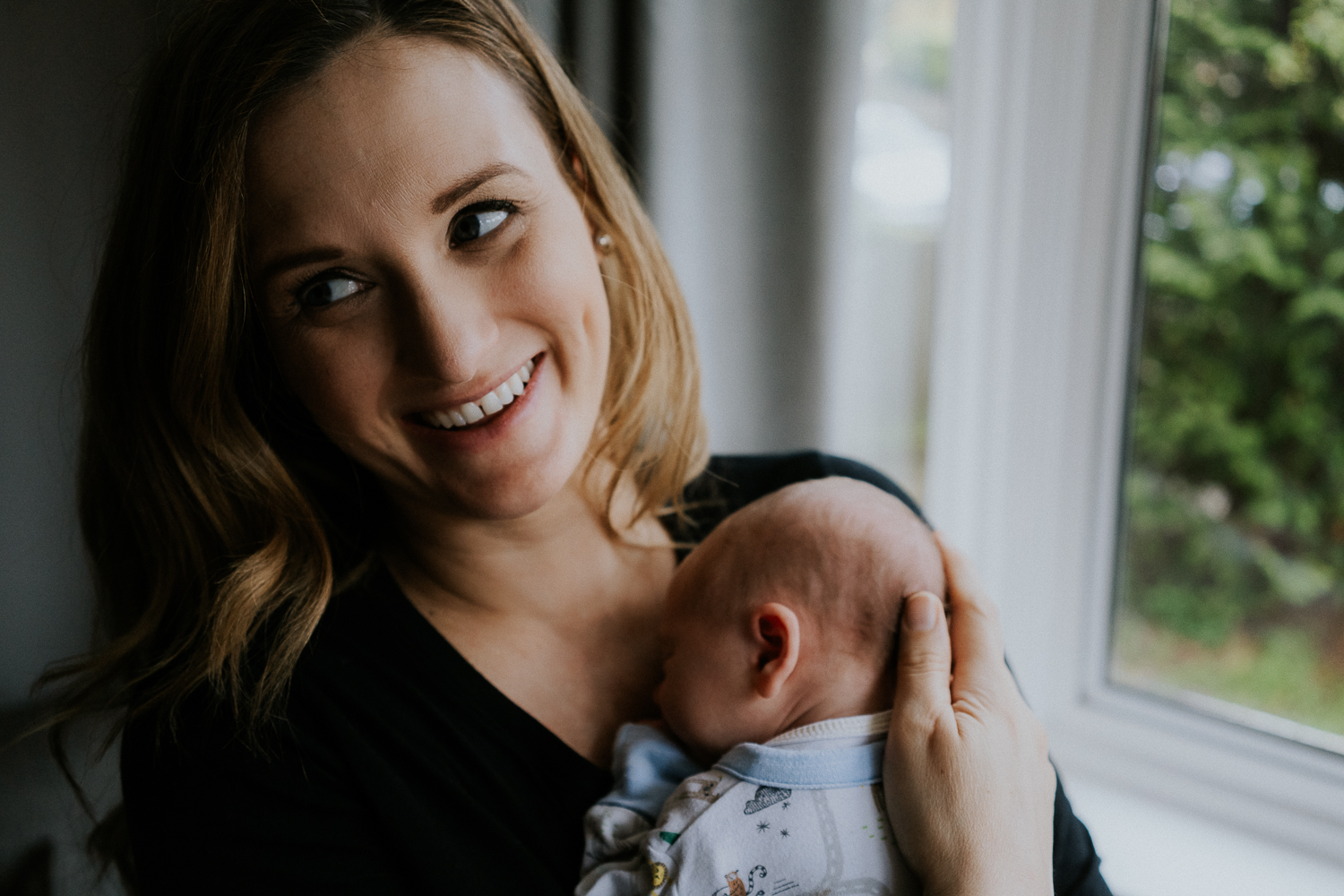 newborn photo session at home in highgate photo of baby boy with mother
