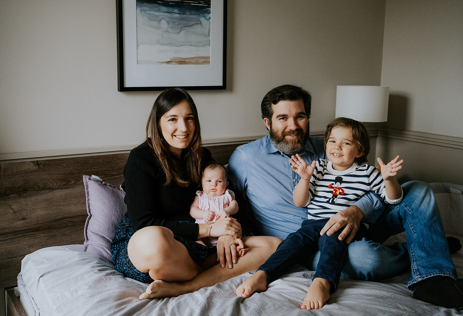 posed family portrait in bedroom newborn photography in hammersmith