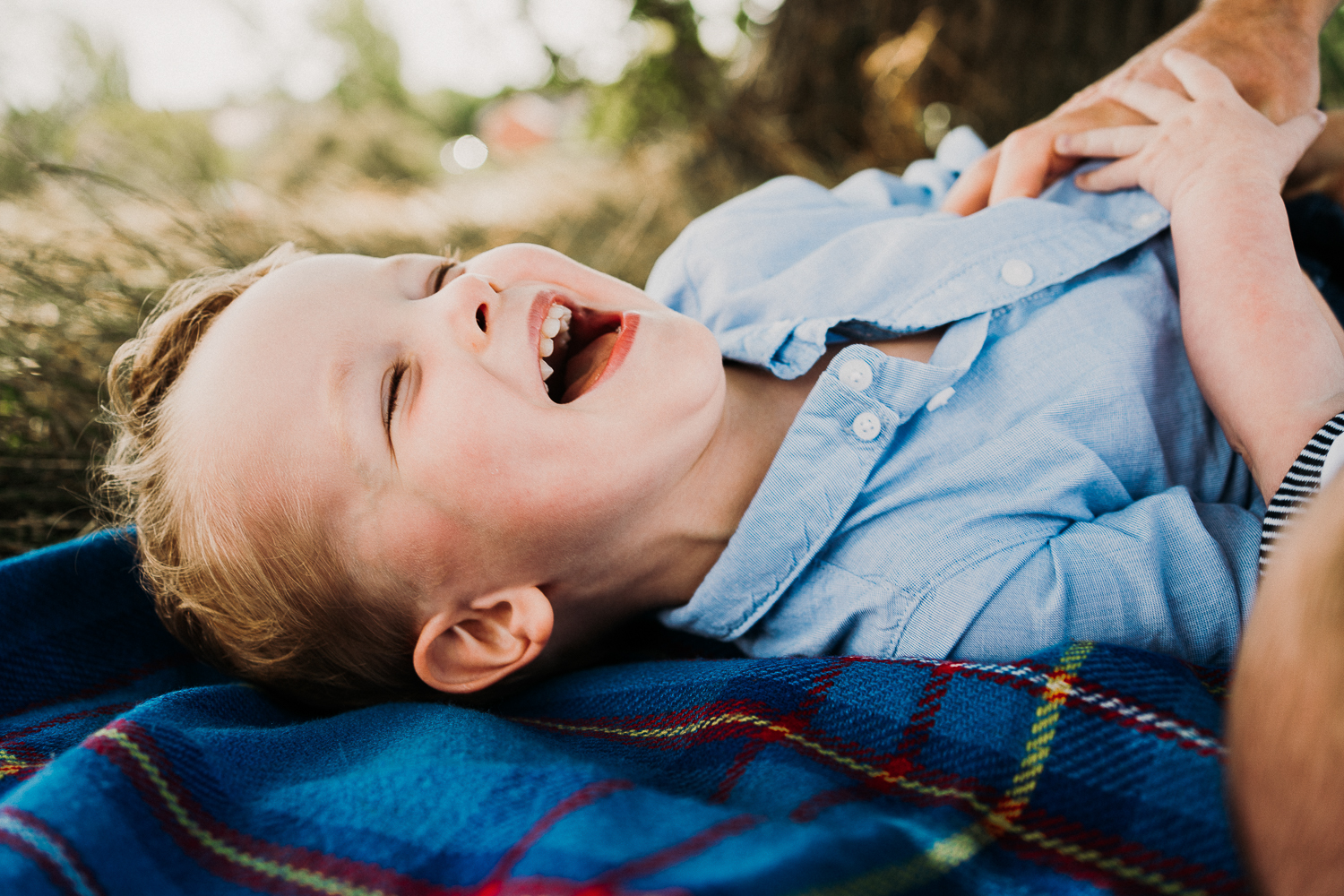 SPRING MINI PHOTO SESSIONS GLADSTONE PARK BOY LAUGHING