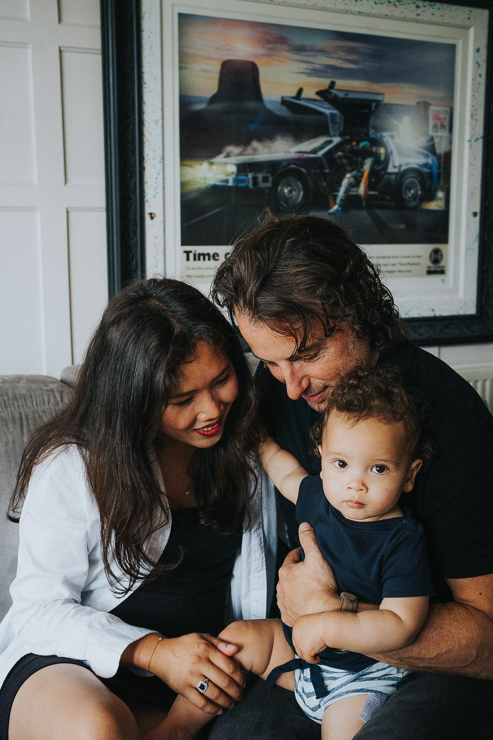 family photo shoot at home toddler boy with parents indoors