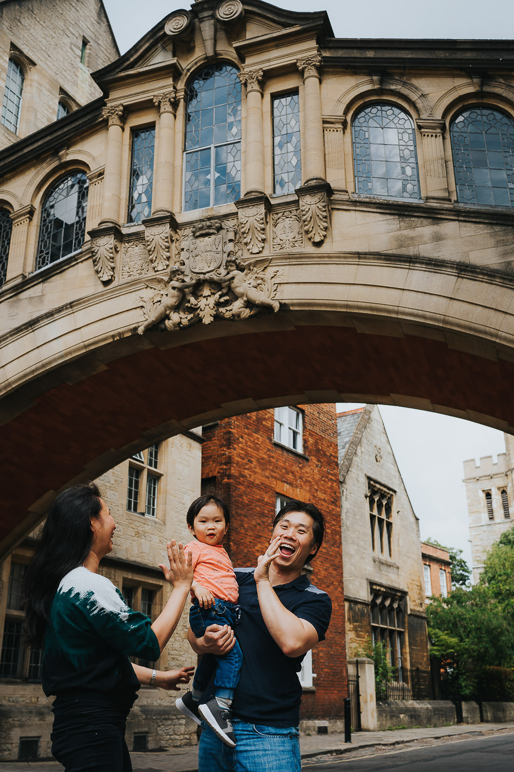oxford family photo shoot toddler and parents playing at bridge of sighs