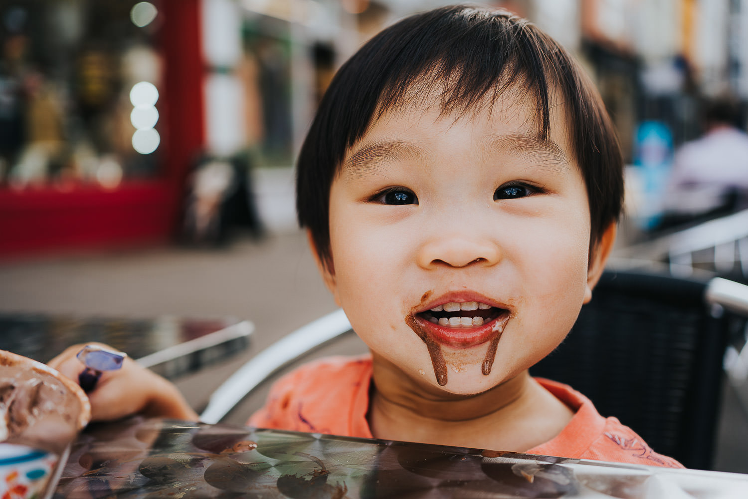 oxford family photo shoot boy eating ice-cream todller at a cafe table