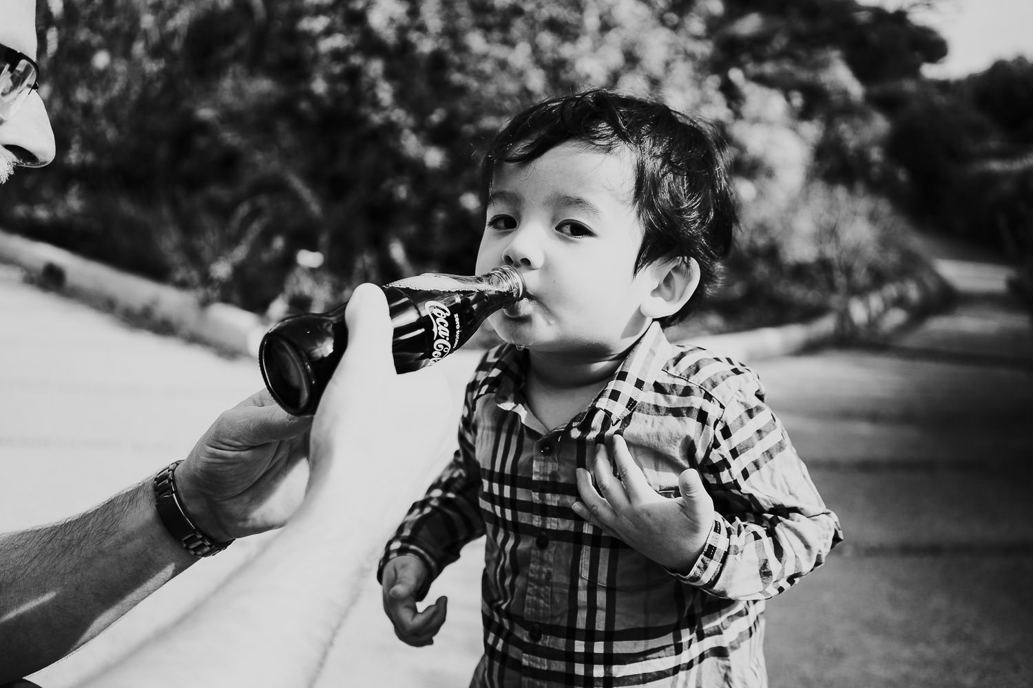 father and son in hotel gardens at a family vacation photo shoot in the south of france grand hotel du cap ferrat