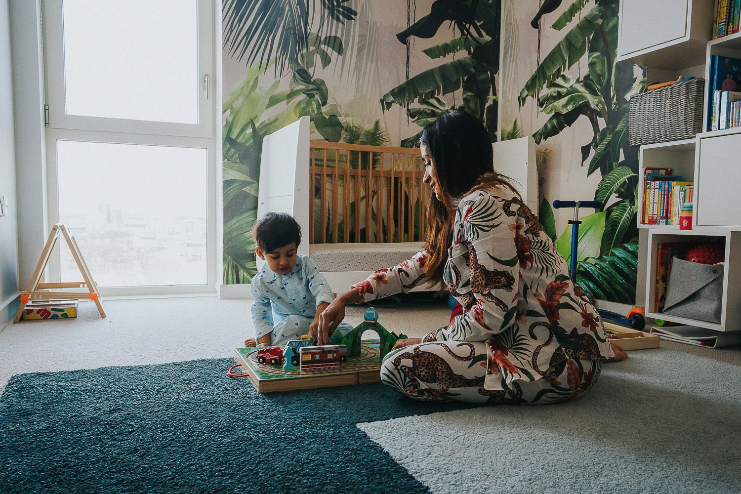SHOREDITCH MATERNITY PHOTO SHOOT MOTHER AND TODDLER SON PLAYING GAMES WEARING PYJAMAS