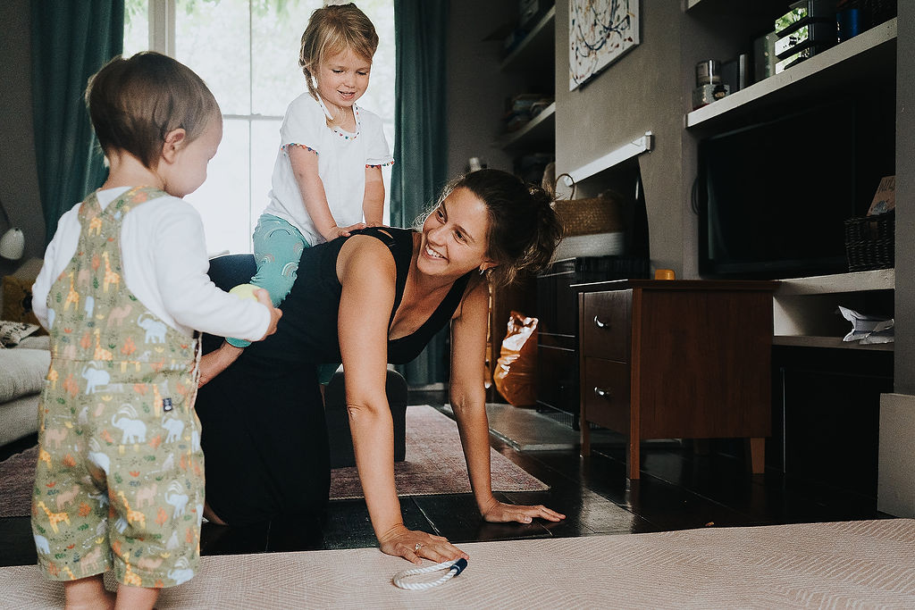 mum playing with children inside
